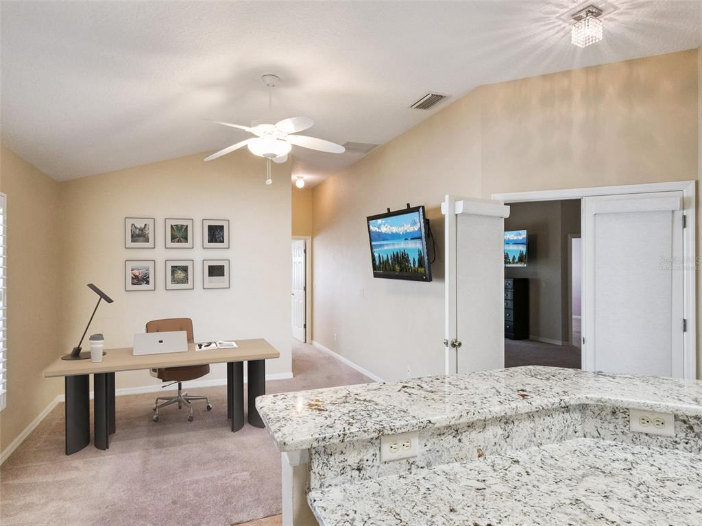 20642 Prince Ranier Place Leesburg, FL 34748 - Photo 7 of 59 a workspace with furniture