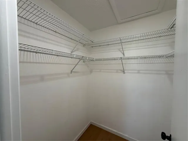 a bathroom with a sink a mirror and a shower