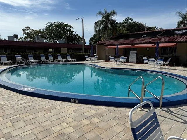 a view of a swimming pool with a patio