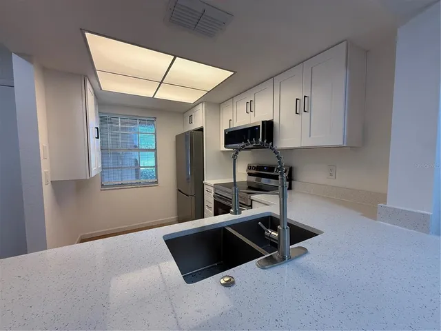 a room with gym equipment and a window