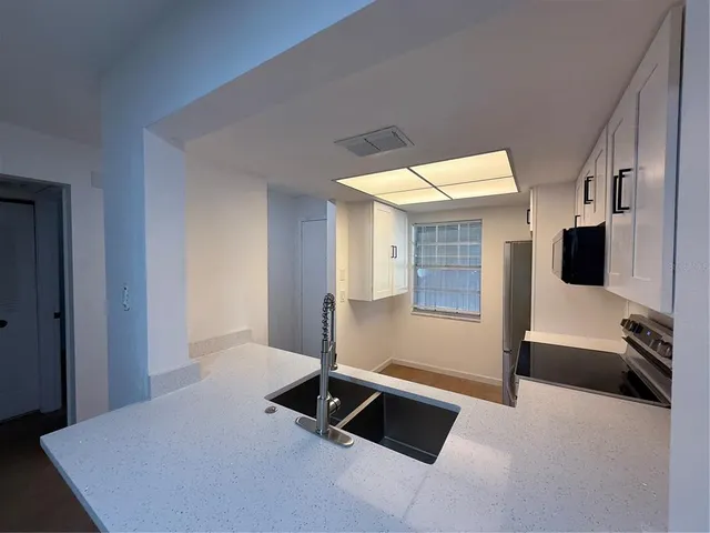 a living room with a couch and a flat screen tv