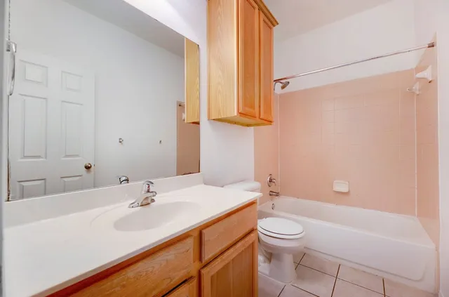 a bathroom with a sink a toilet and a bathtub