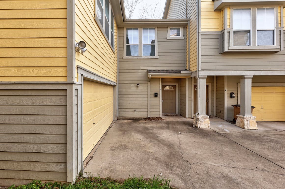 710 Franklin Boulevard, Unit C Austin, TX 78751 - Photo 5 of 29 a view of a house with a wooden fence