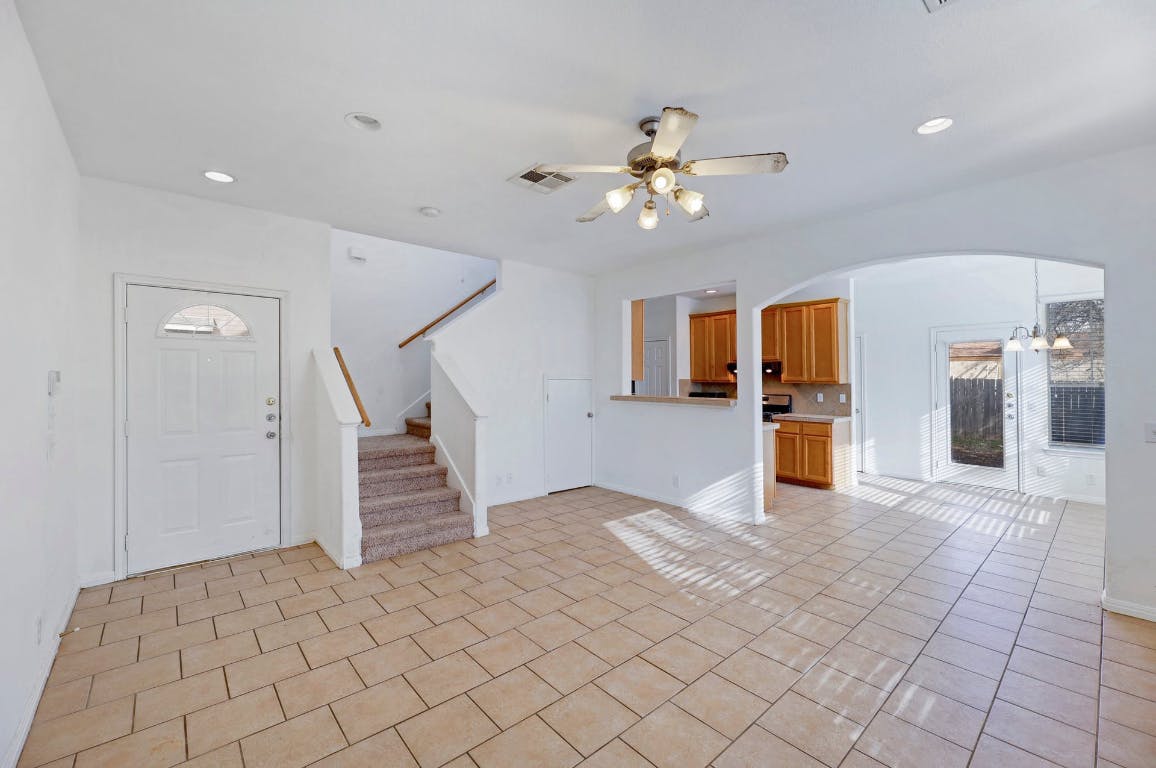 710 Franklin Boulevard, Unit C Austin, TX 78751 - Photo 7 of 29 a view of empty room with wooden floor and ceiling fan