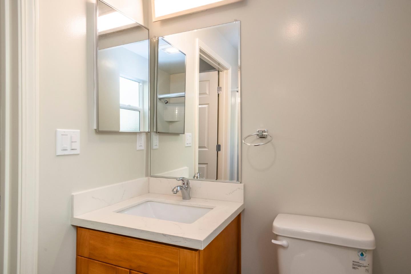 1007 Hemlock Avenue Millbrae, CA 94030 - Photo 12 of 34 a bathroom with a sink toilet and mirror