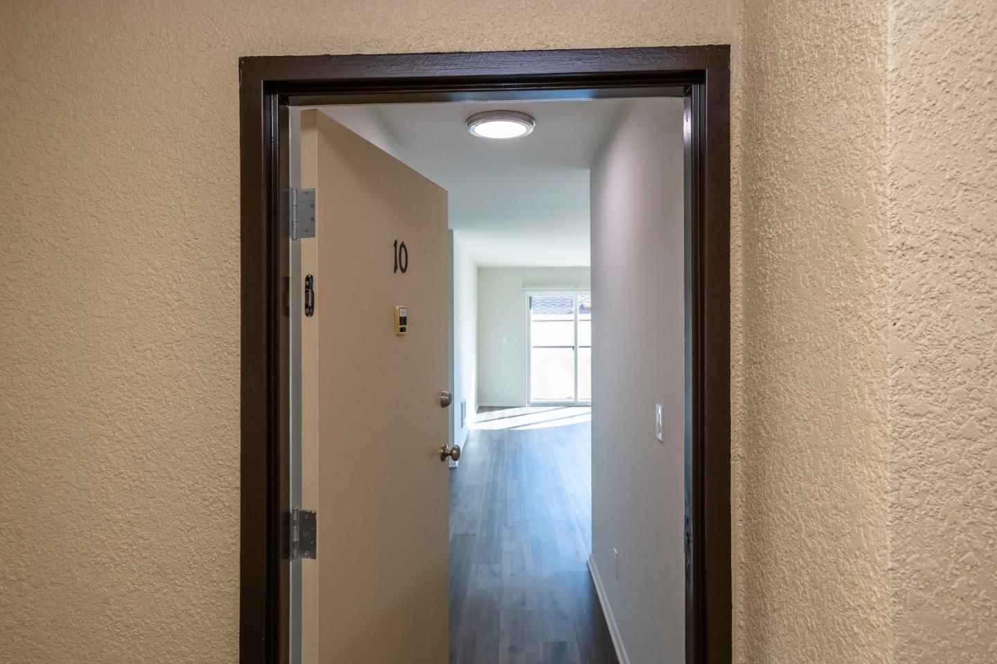 1007 Hemlock Avenue Millbrae, CA 94030 - Photo 4 of 34 a view of a hallway with wooden floor