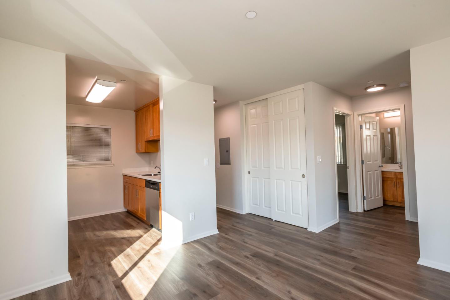 1007 Hemlock Avenue Millbrae, CA 94030 - Photo 7 of 34 a view of a kitchen with wooden floor and a sink