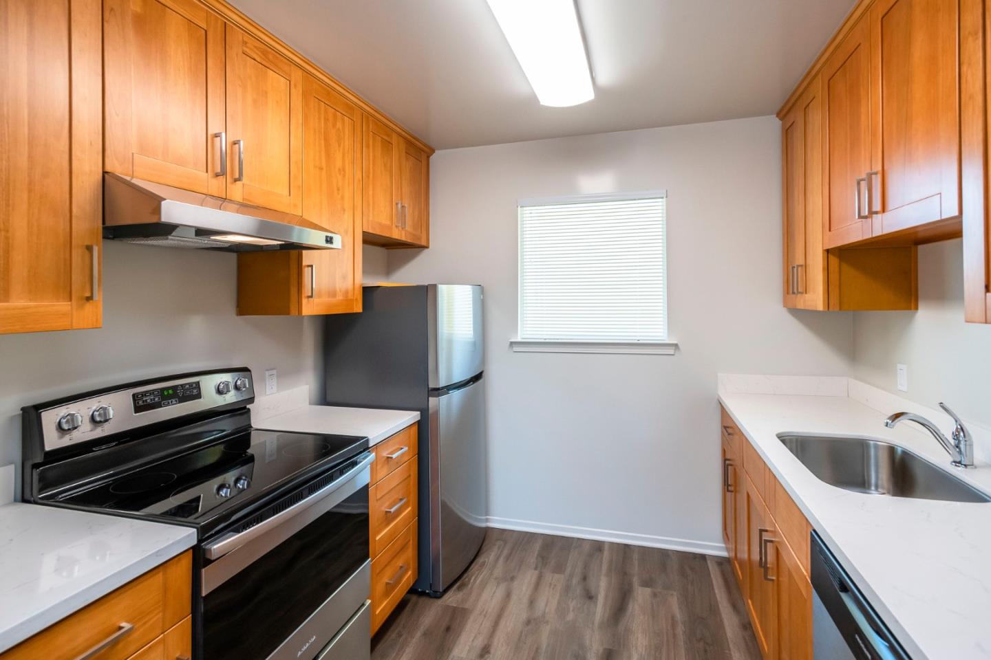 1007 Hemlock Avenue Millbrae, CA 94030 - Photo 8 of 34 a kitchen with a sink a stove and a refrigerator