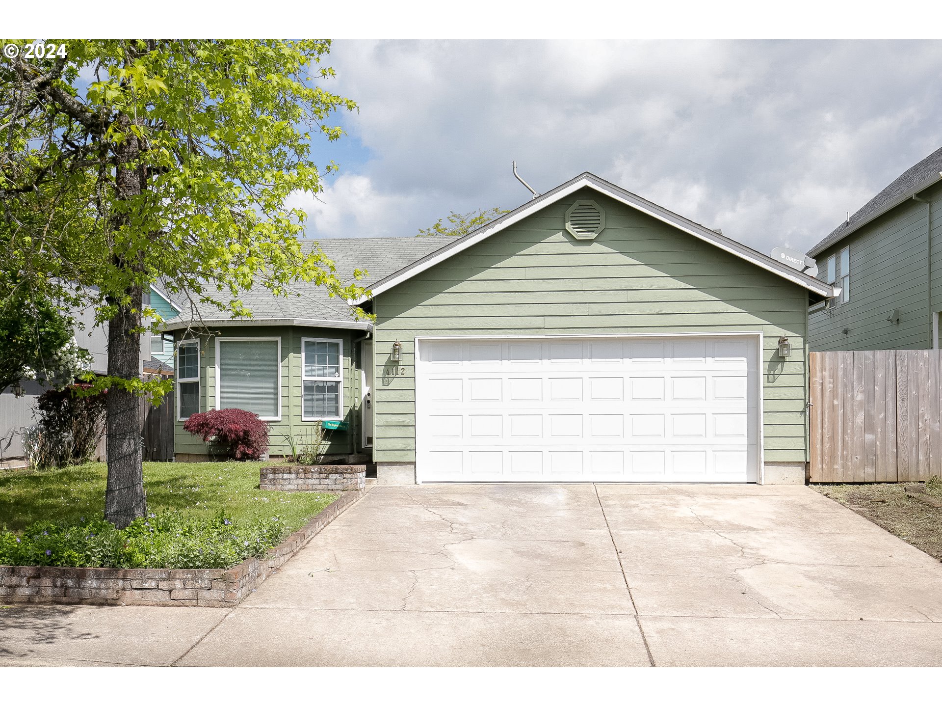 4112 South E Street Springfield, OR 97478 - Photo 1 of 21 a view of a house with a yard and potted plants