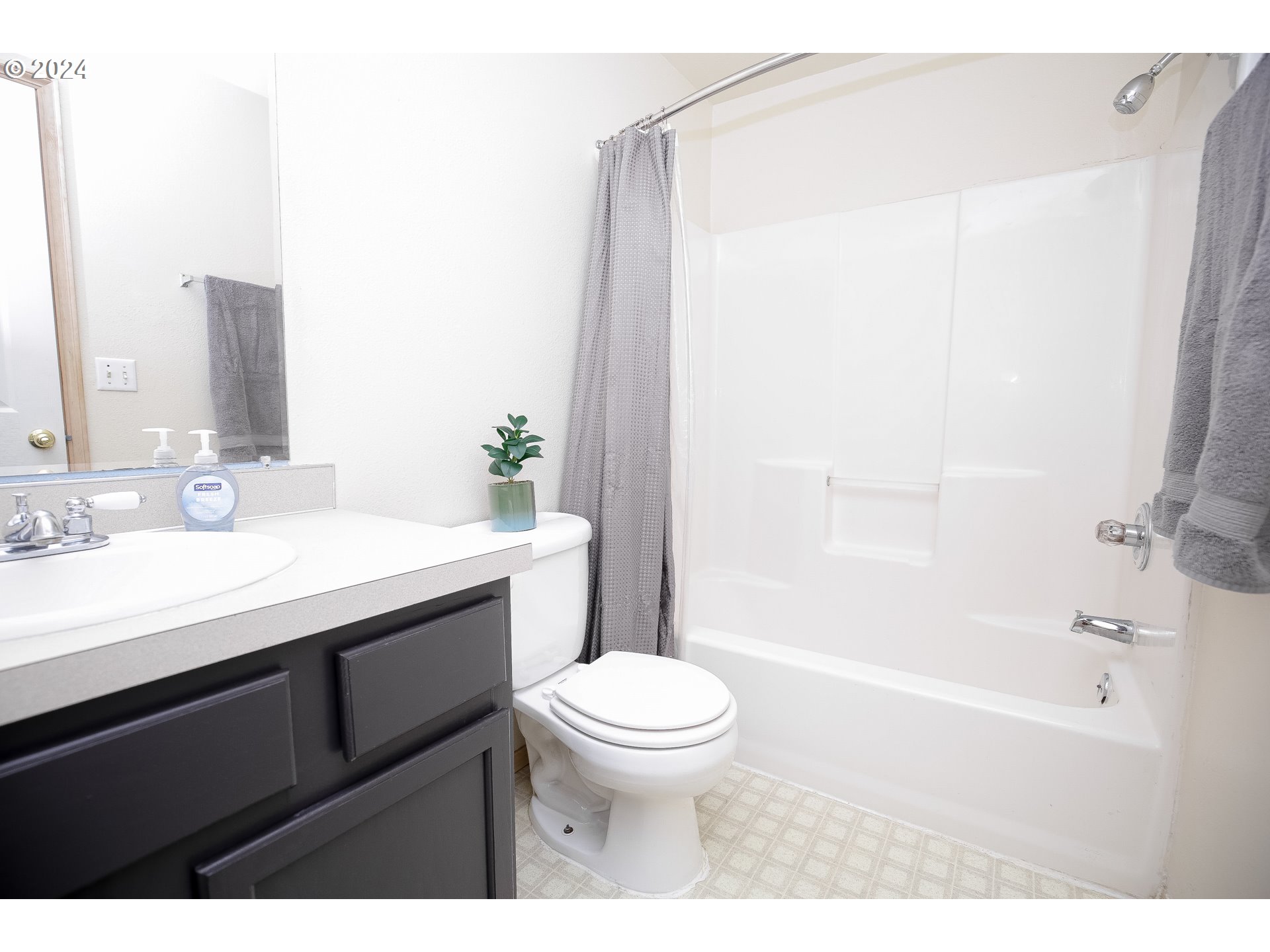 4112 South E Street Springfield, OR 97478 - Photo 11 of 21 a bathroom with a sink a toilet and shower