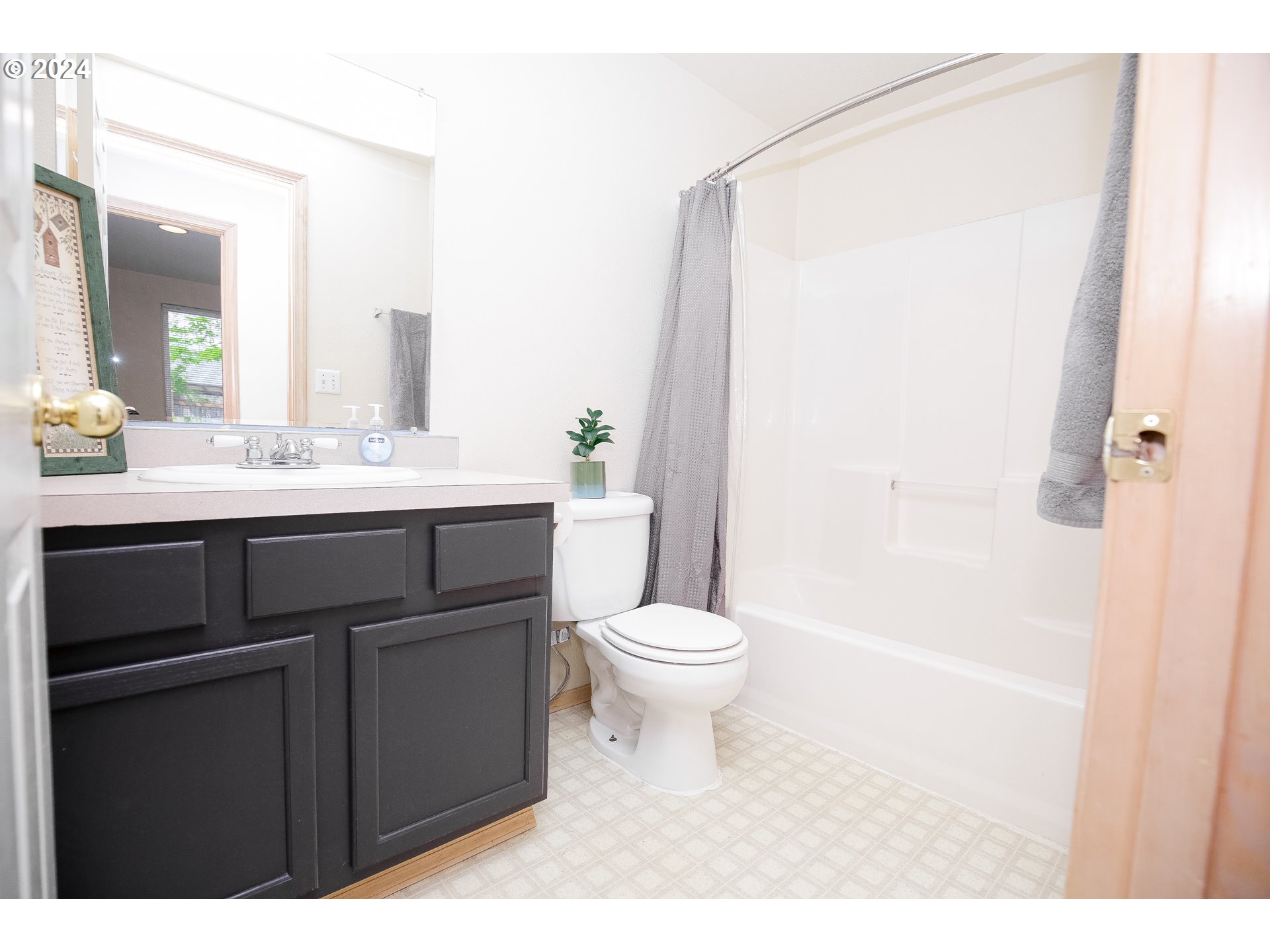 4112 South E Street Springfield, OR 97478 - Photo 12 of 21 a bathroom with a sink a toilet and shower