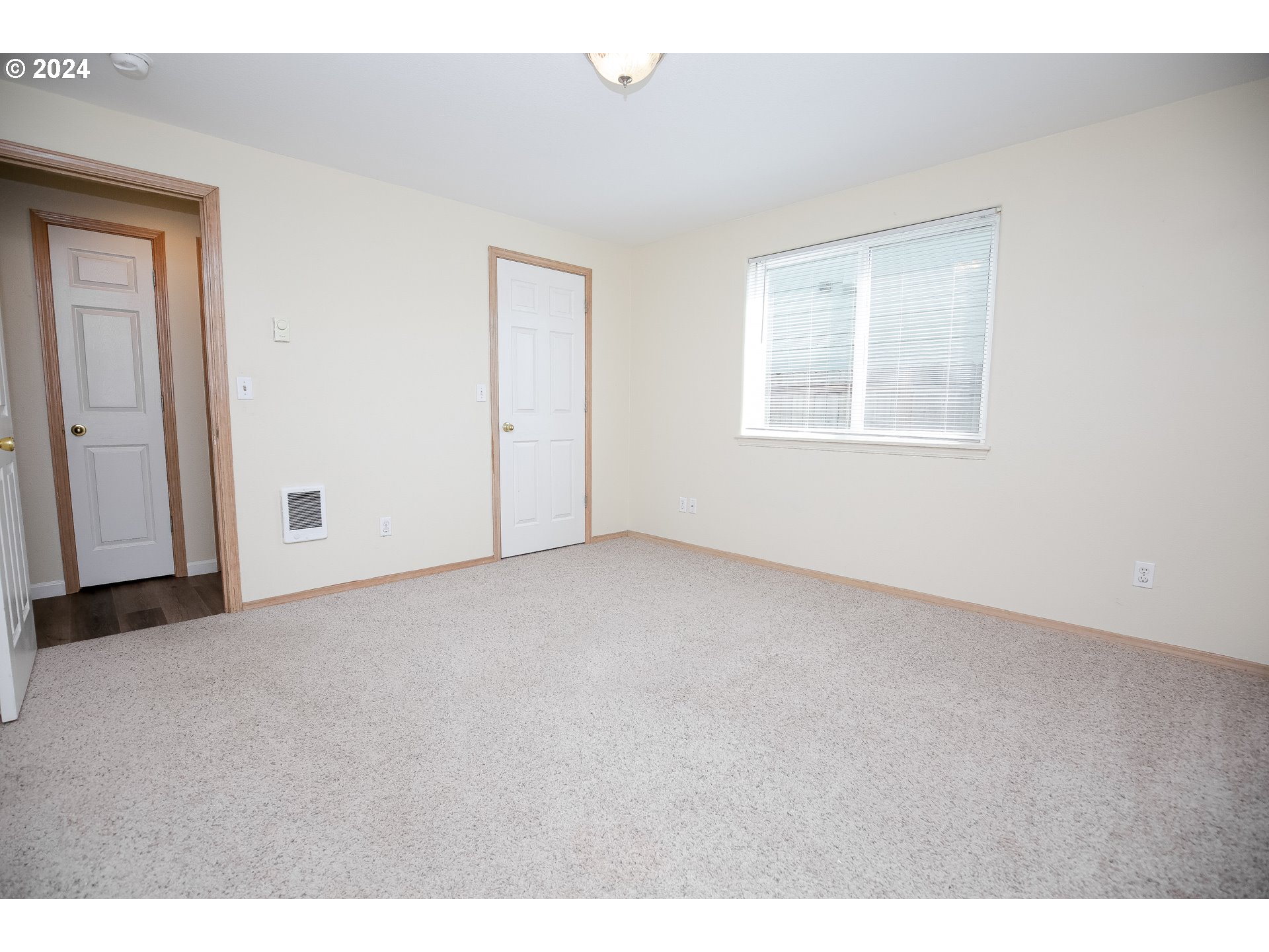 4112 South E Street Springfield, OR 97478 - Photo 13 of 21 a view of an empty room with a window