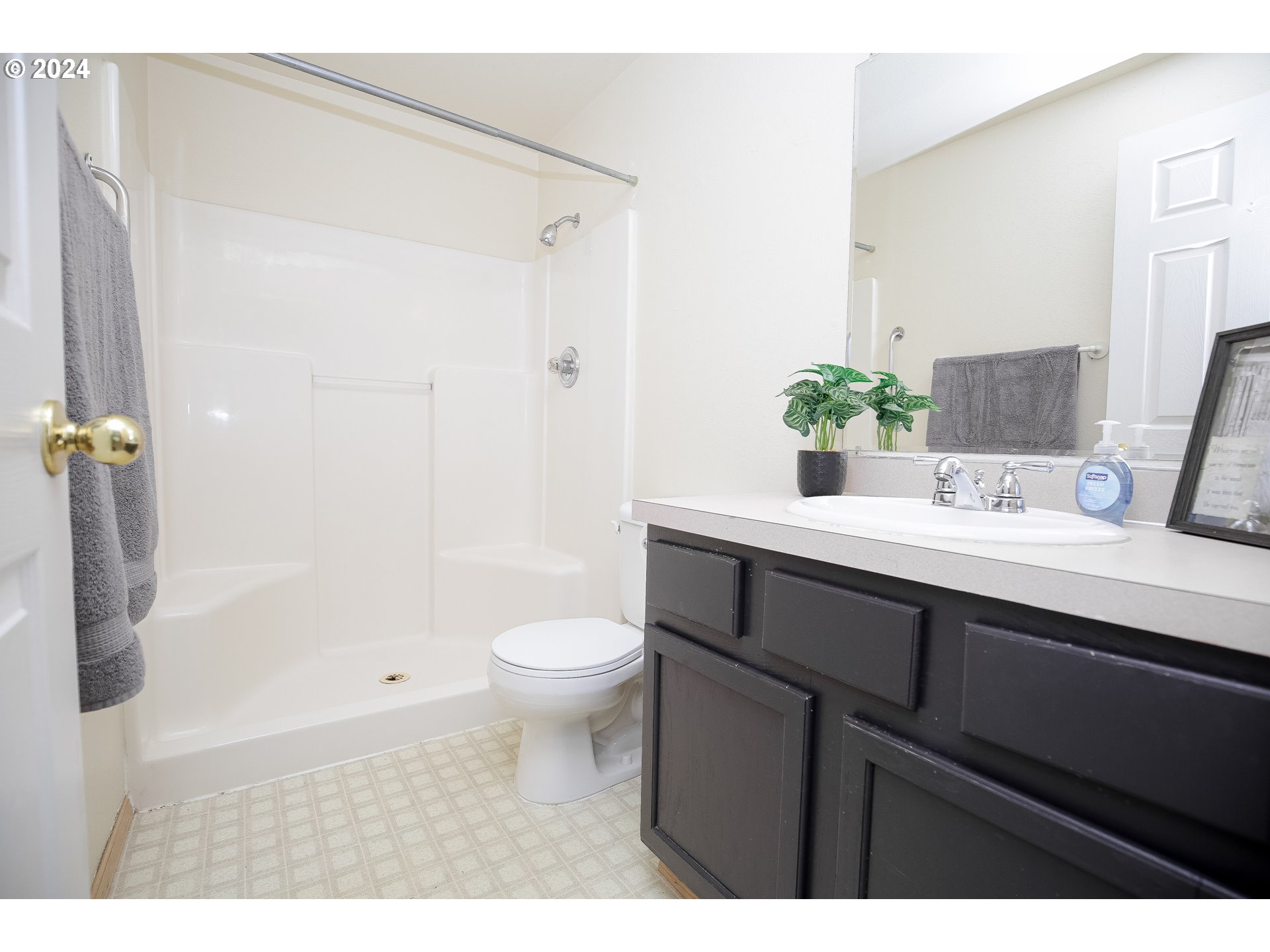 4112 South E Street Springfield, OR 97478 - Photo 15 of 21 a bathroom with a sink a toilet a shower and a mirror