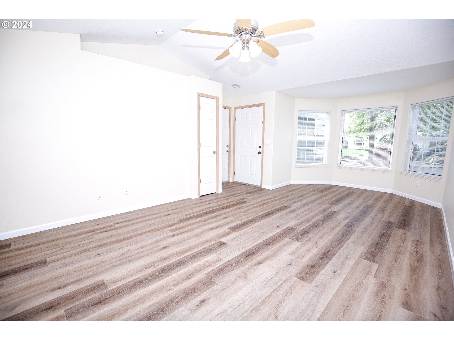 4112 South E Street Springfield, OR 97478 - Photo 7 of 21 a view of empty room with wooden floor and fan