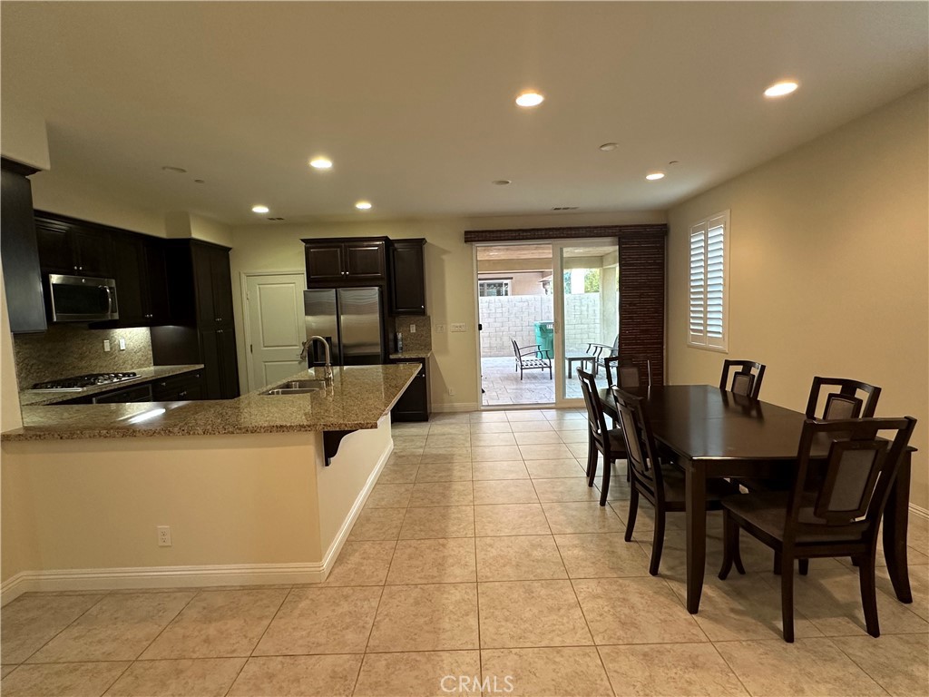 219 Wicker Irvine, CA 92618 - Photo 3 of 19 a view of a dining room with furniture