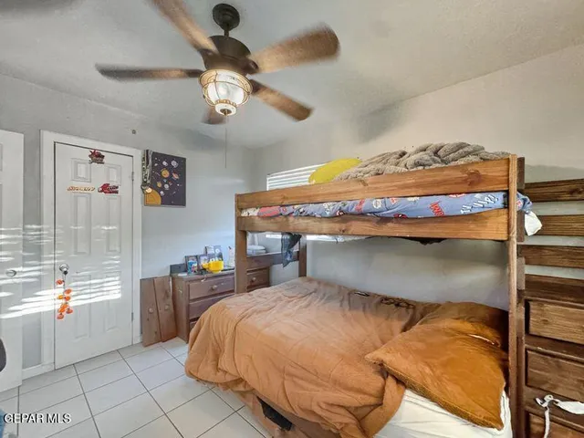 a bathroom with a sink a toilet and shower curtain