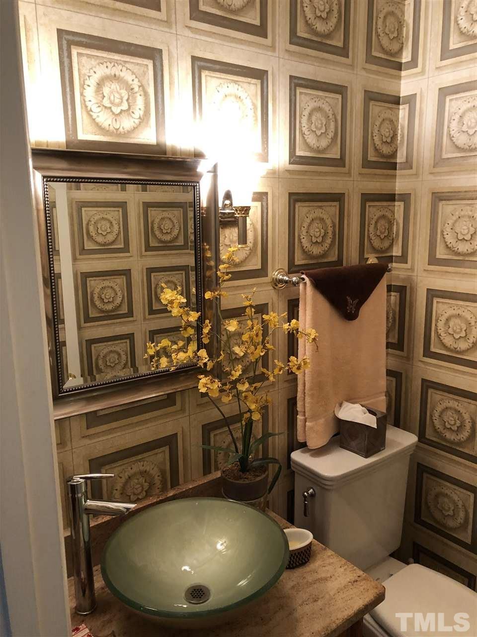 3907 Converse Drive Raleigh, NC 27609 - Photo 11 of 30 a bathroom with a toilet and a sink