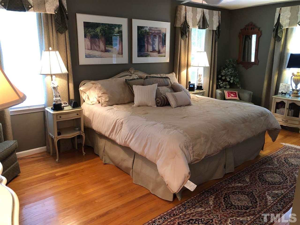 3907 Converse Drive Raleigh, NC 27609 - Photo 16 of 30 a large bed sitting in a bedroom next to a window