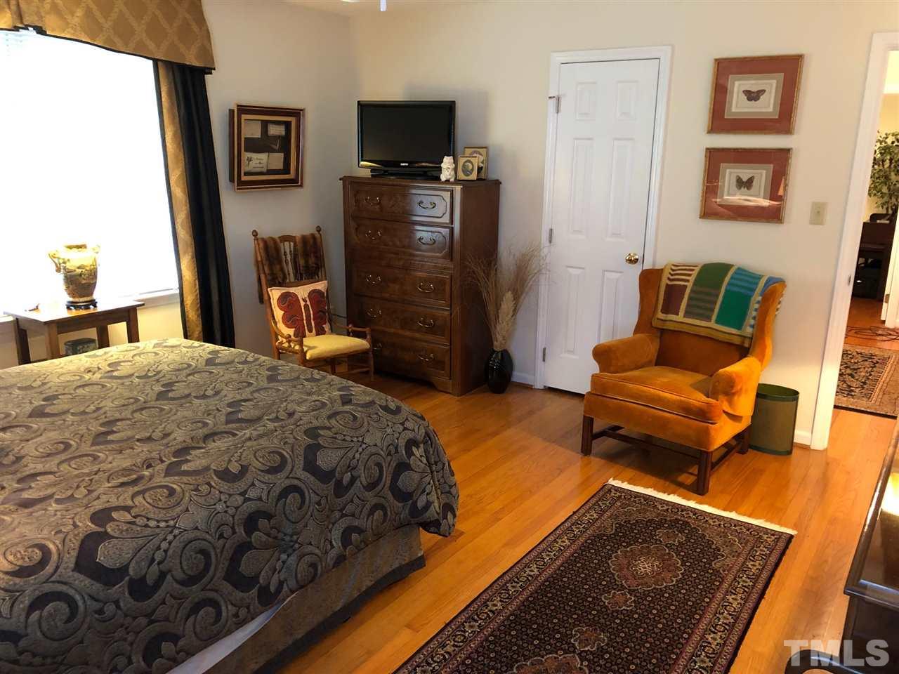 3907 Converse Drive Raleigh, NC 27609 - Photo 20 of 30 a bedroom with a bed and furniture