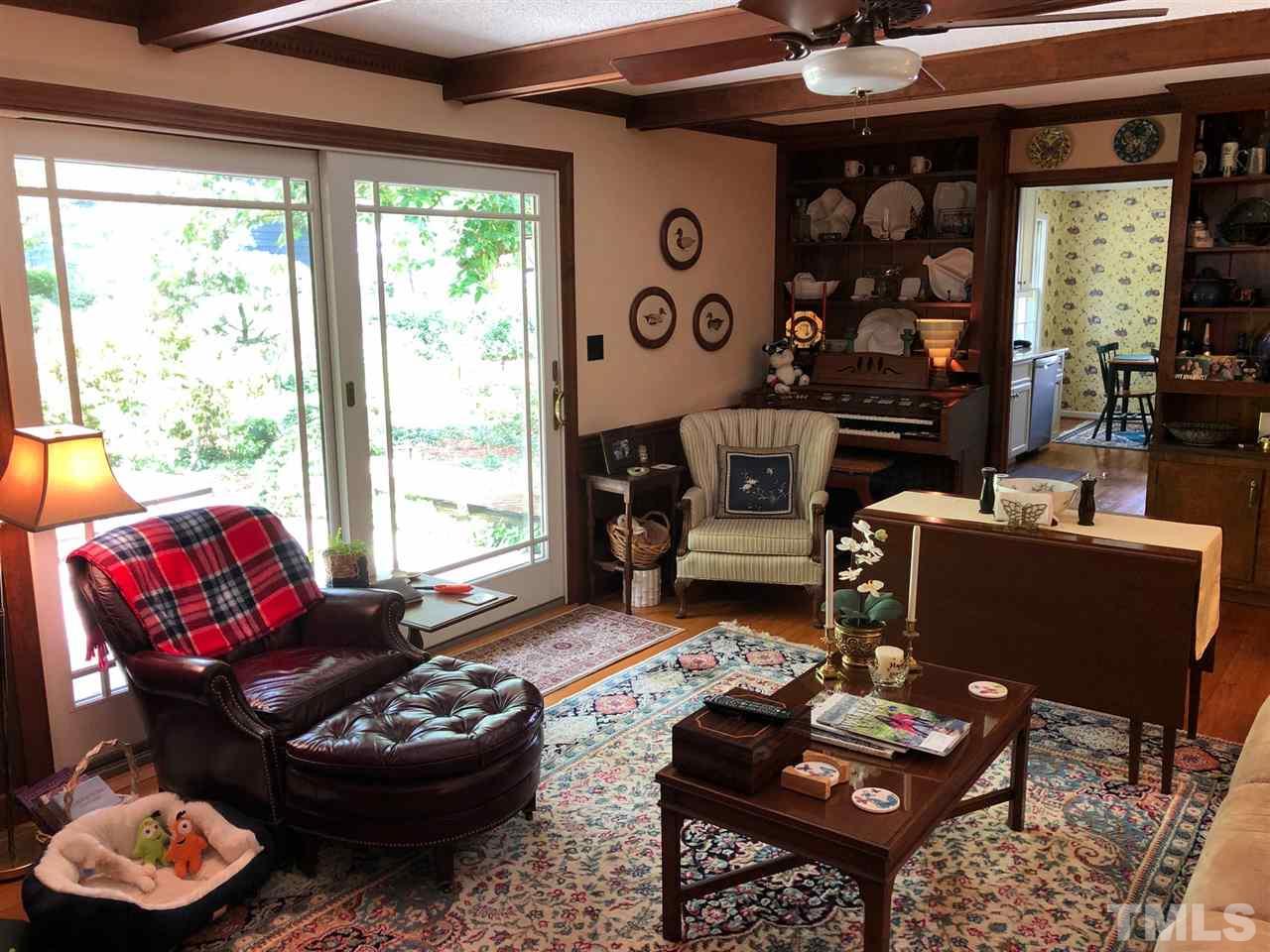 3907 Converse Drive Raleigh, NC 27609 - Photo 7 of 30 a living room with furniture and a large window