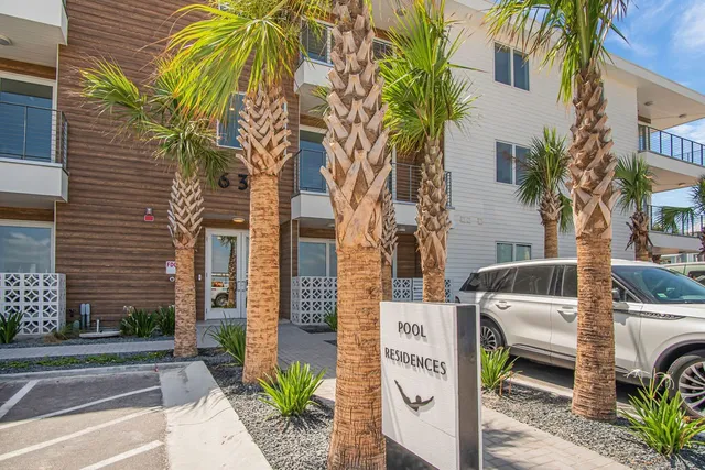 a view of a car park in front of a building