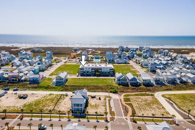 an aerial view of a house with a swimming pool yard and outdoor seating