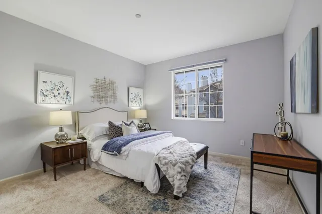 a bathroom with a sink a toilet a shower and a mirror