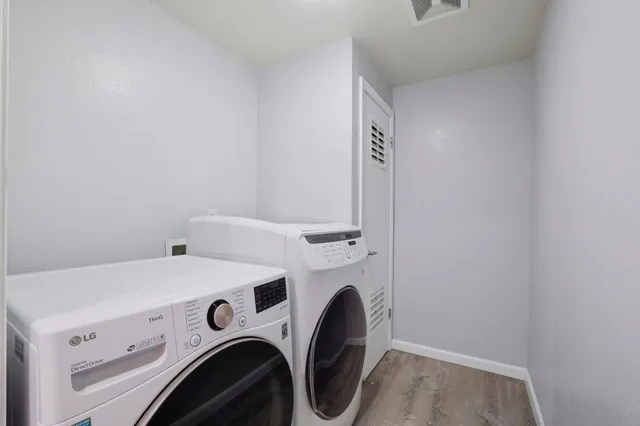 a view of a chair and table in the balcony