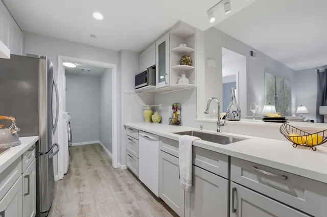 a spacious bathroom with a sink double vanity and a mirror