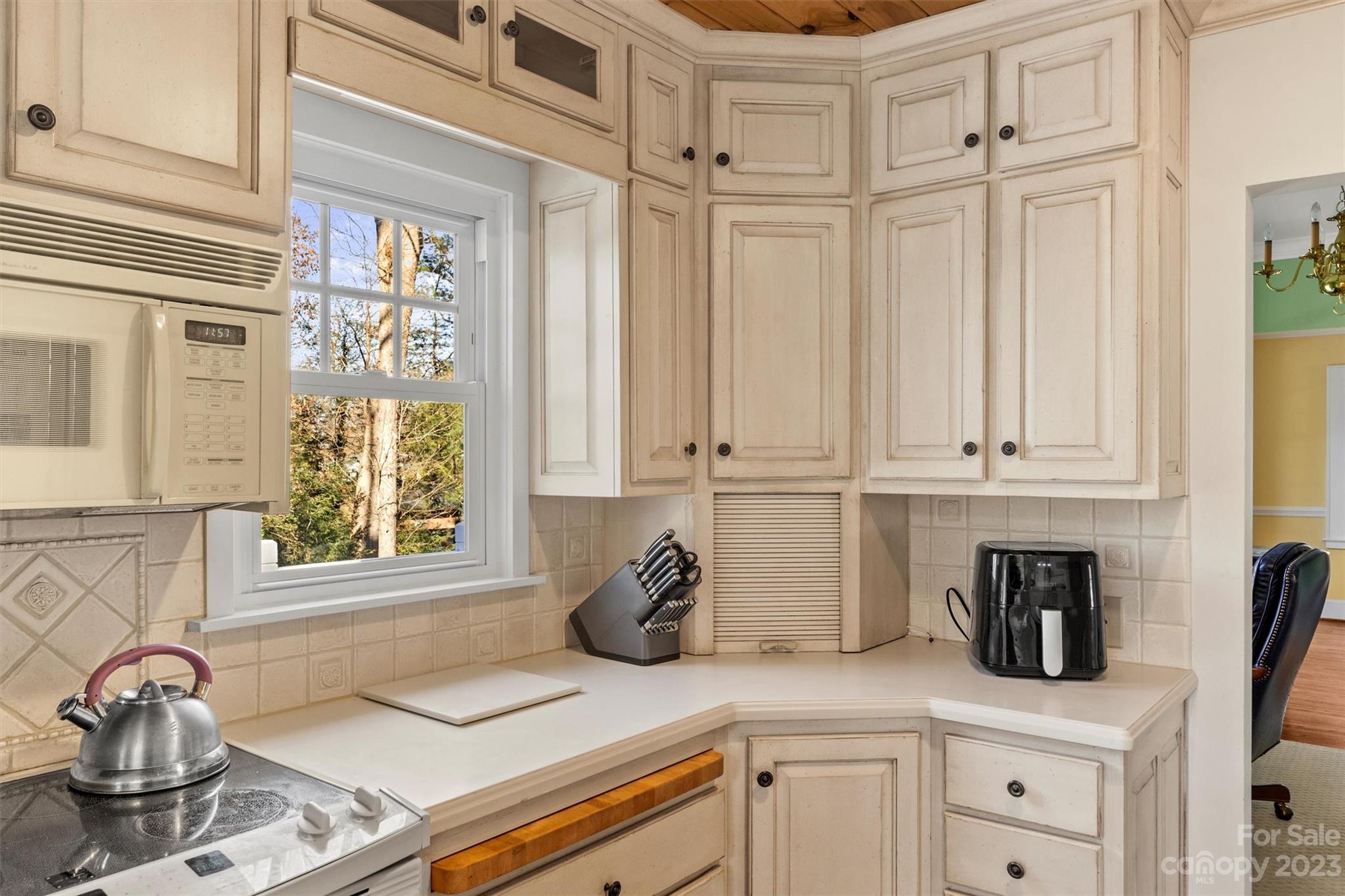116 Riverside Court Morganton, NC 28655 - Photo 12 of 40 a kitchen with granite countertop white cabinets and window