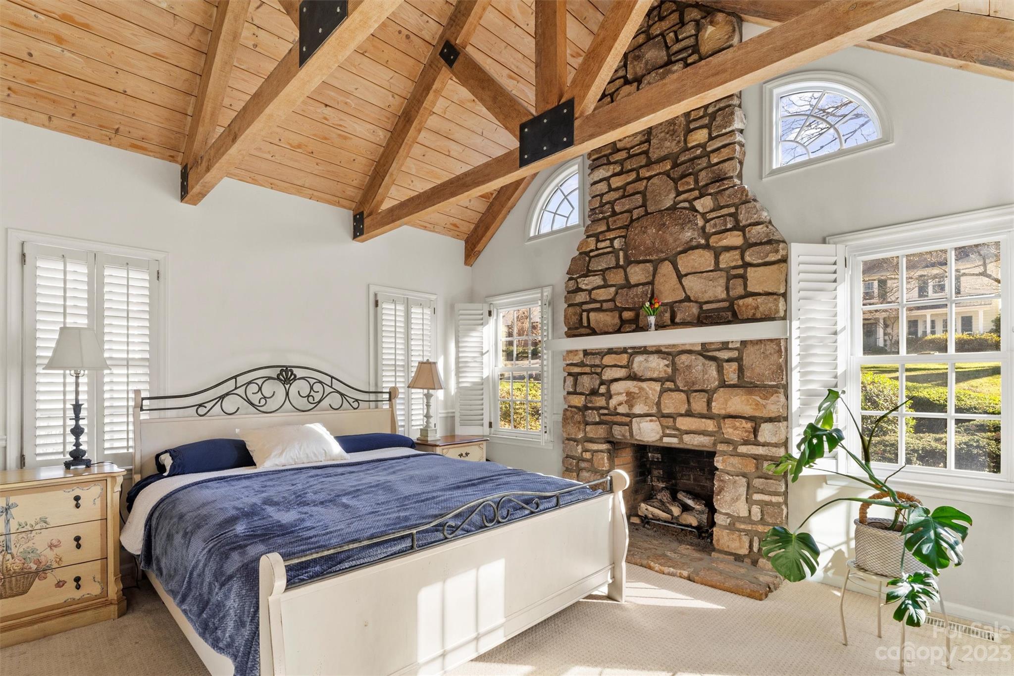 116 Riverside Court Morganton, NC 28655 - Photo 20 of 40 a bedroom with a bed and a fireplace