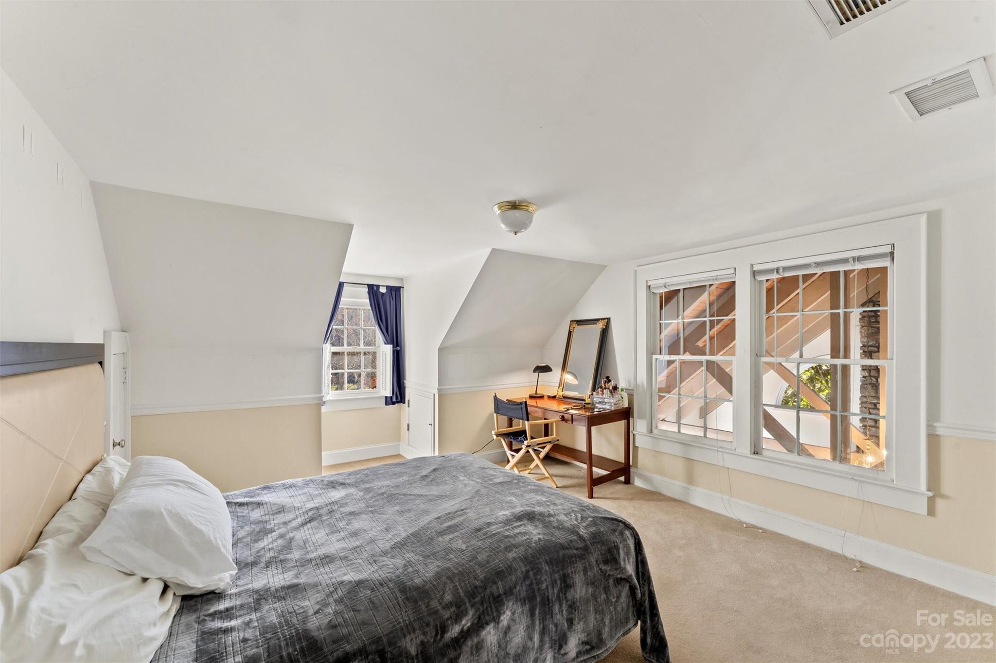 116 Riverside Court Morganton, NC 28655 - Photo 25 of 40 a bedroom with a bed chair and three windows