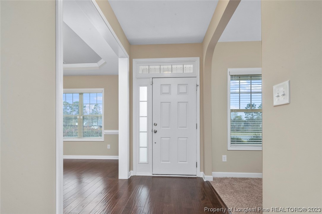 152 Copper Loop Sanford, NC 27332 - Photo 13 of 50 a view of front door with wooden floor