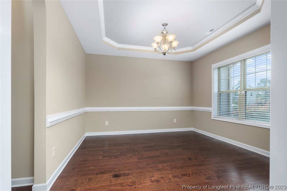 152 Copper Loop Sanford, NC 27332 - Photo 14 of 50 wooden floor in an empty room with a window