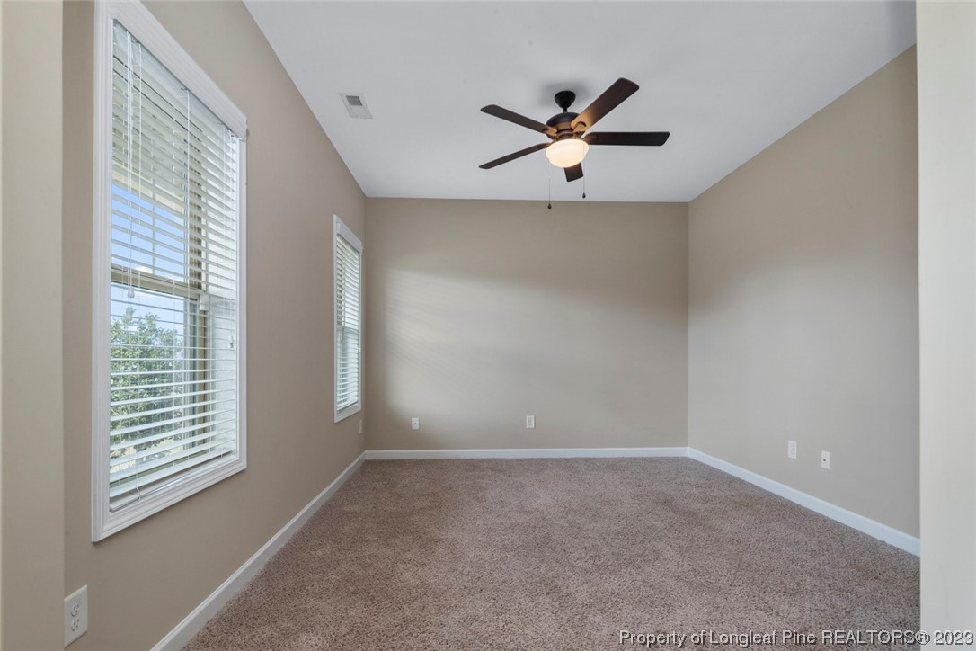 152 Copper Loop Sanford, NC 27332 - Photo 16 of 50 a view of an empty room with a window