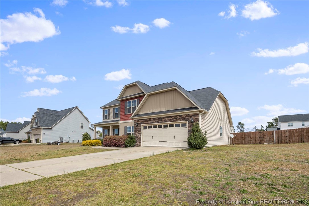 152 Copper Loop Sanford, NC 27332 - Photo 2 of 50 a front view of a house with a yard