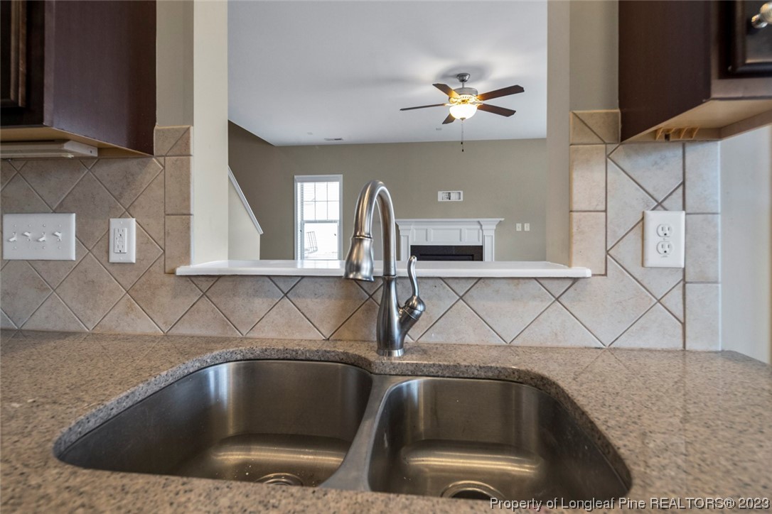 152 Copper Loop Sanford, NC 27332 - Photo 26 of 50 a kitchen with a sink and cabinets