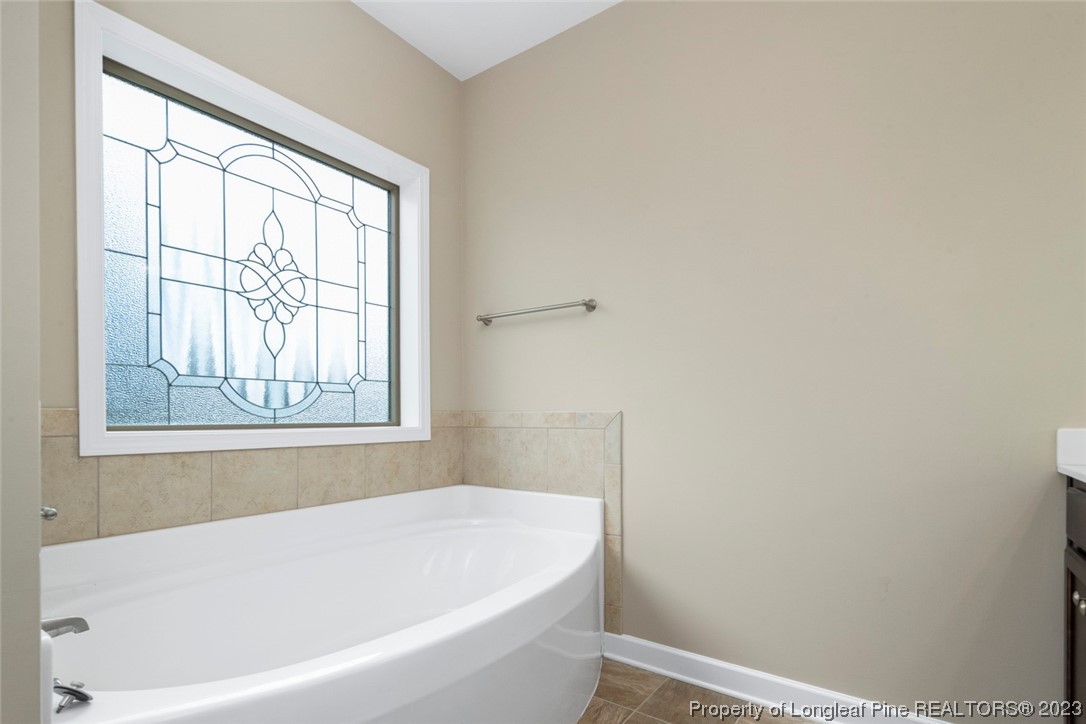 152 Copper Loop Sanford, NC 27332 - Photo 33 of 50 a white bath tub sitting next to a window