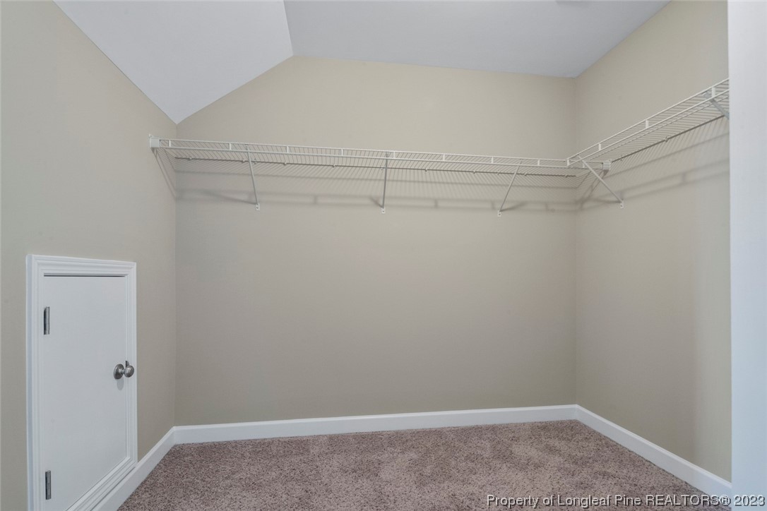 152 Copper Loop Sanford, NC 27332 - Photo 40 of 50 a view of a room with racks on the wall