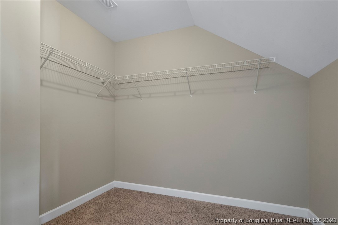 152 Copper Loop Sanford, NC 27332 - Photo 47 of 50 a view of a room with racks on the wall