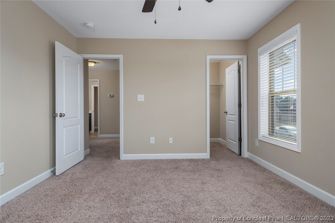 152 Copper Loop Sanford, NC 27332 - Photo 49 of 50 an empty room with windows and closet
