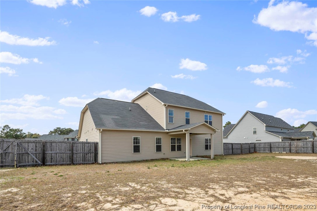 152 Copper Loop Sanford, NC 27332 - Photo 8 of 50 a front view of a house with a yard