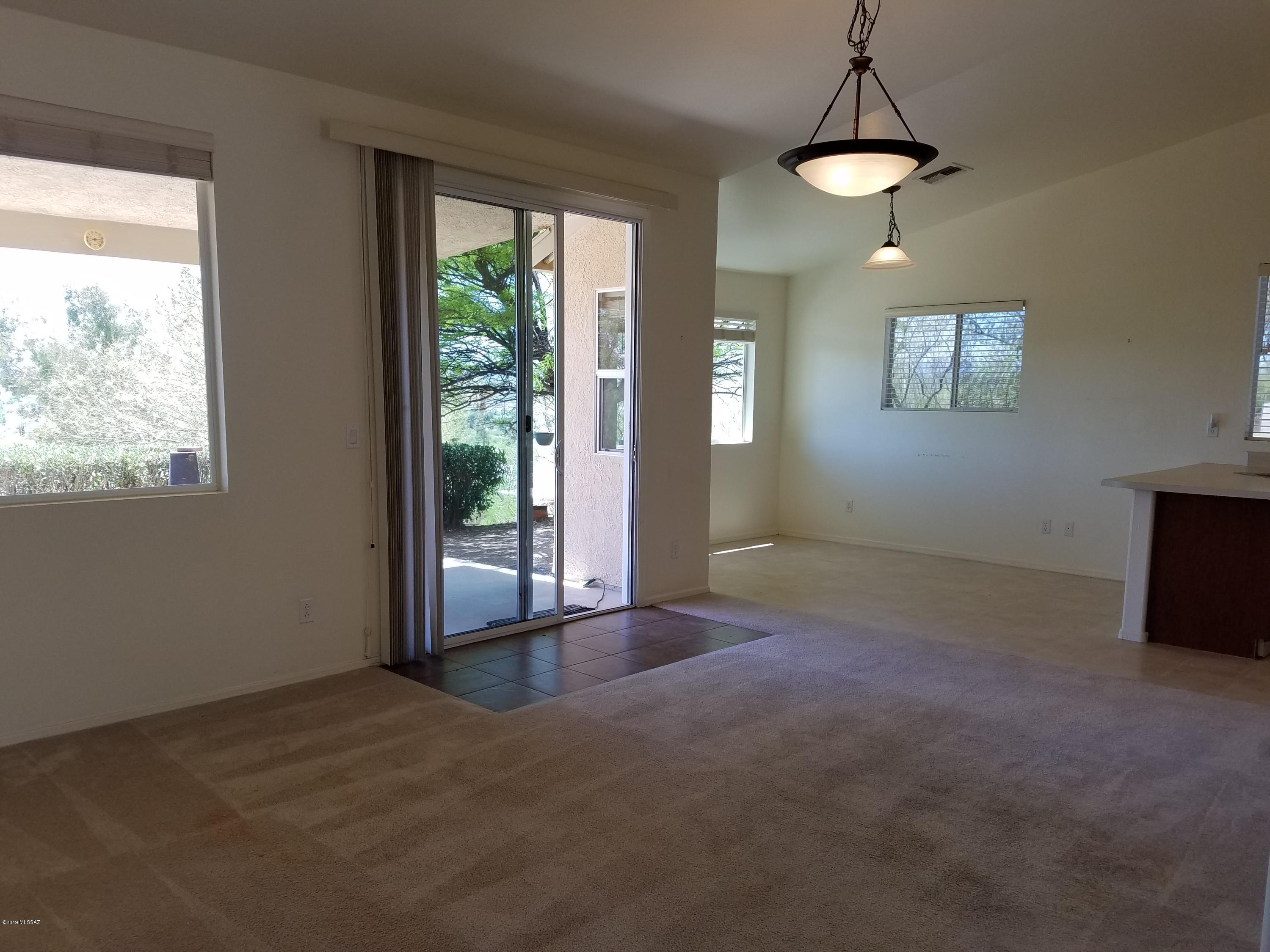 1175 Avenida Leon Rio Rico, AZ 85648 - Photo 10 of 24 a view of an empty room with window and chandelier fan
