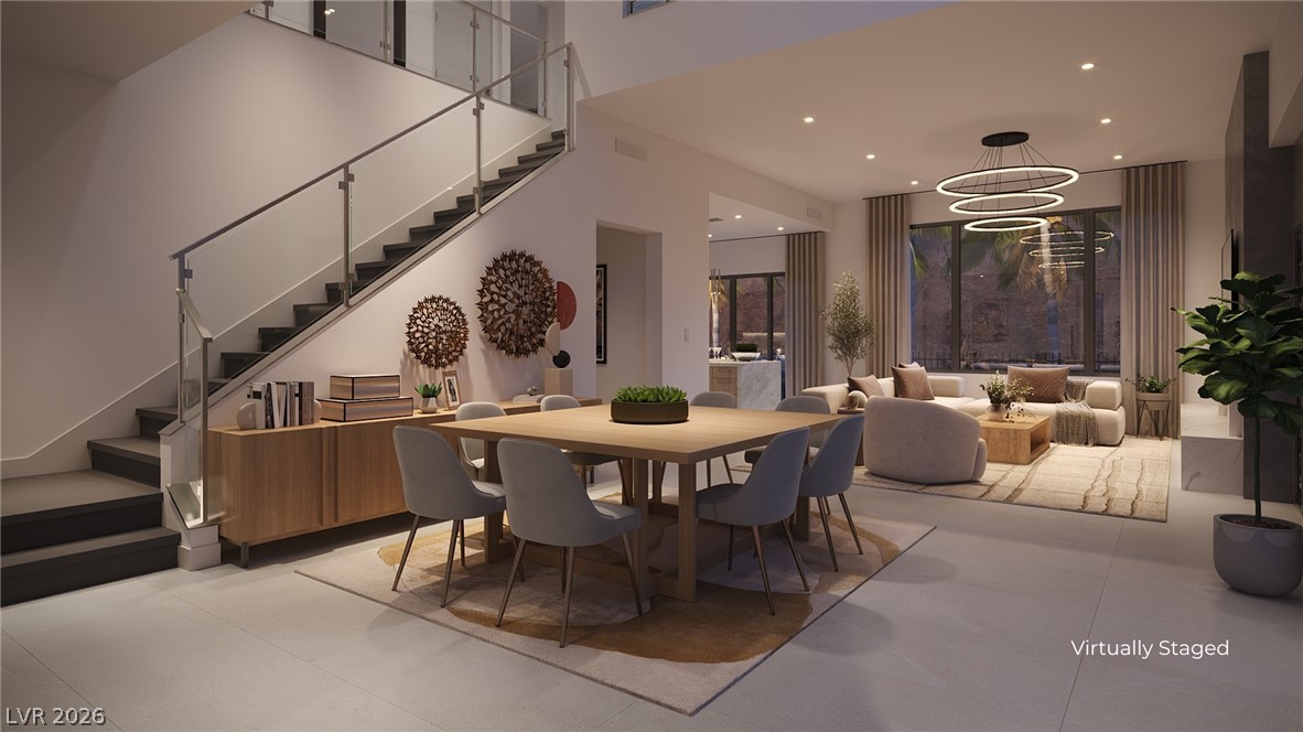 505 Overlook Rim Drive Henderson, NV 89012 - Photo 5 of 22 An open-concept dining room and great room with abundant natural light and a contemporary staircase.