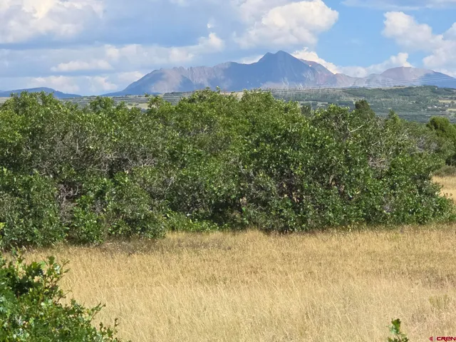a view of lake with mountain in the background