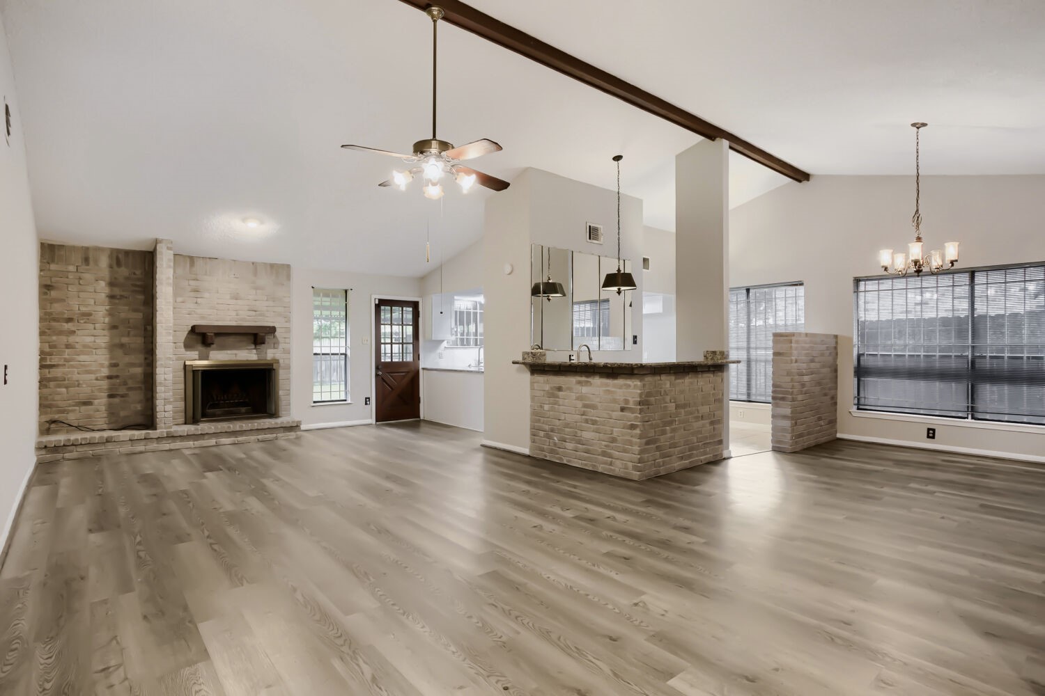 10103 Inwood Shadows Street Houston, TX 77088 - Photo 2 of 32 a view of a kitchen with a sink and a fireplace