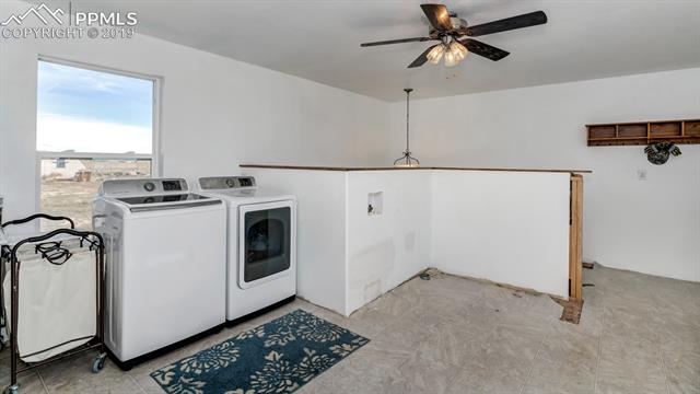755 Edison Road Yoder, CO 80864 - Photo 22 of 29 This Wide Open Room is a backdoor Entry to main floor and huge stairway leading to beautiful french doors in basement. This Laundry Room is Plumbed for 2 Sets of Machines-Offers LOTS of Natural Lighting and Ceiling Fan for airflow.