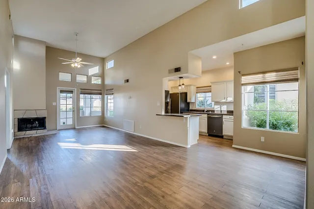 a view of a kitchen with cabinets and wooden floor
