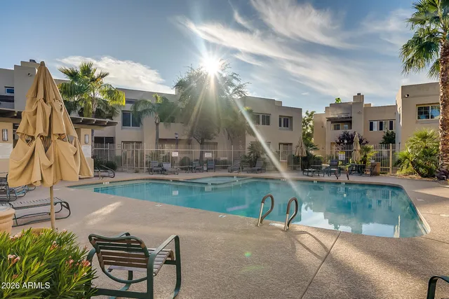 a view of a swimming pool with a patio