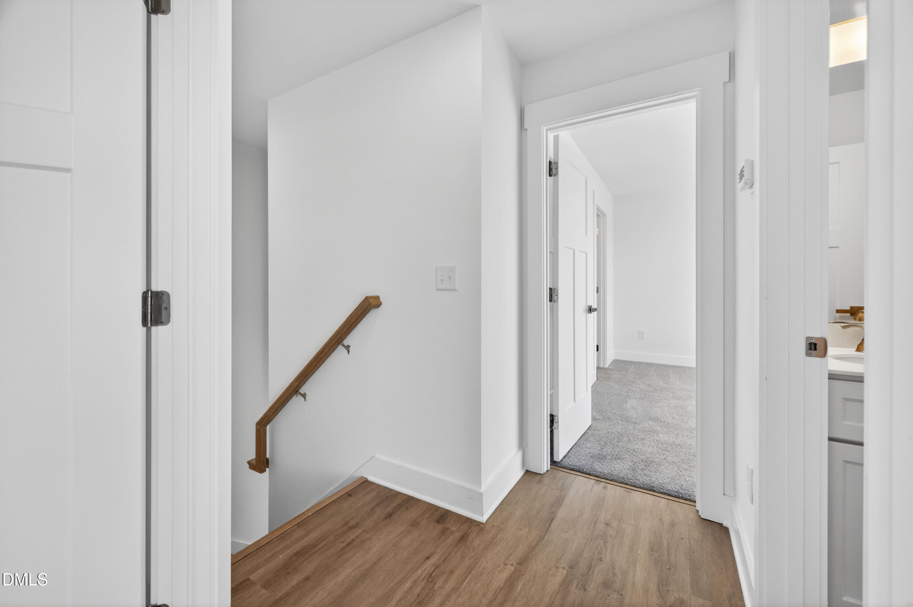 1238 Hurdle Mills Road Roxboro, NC 27573 - Photo 28 of 50 a view of a hallway with wooden floor and staircase